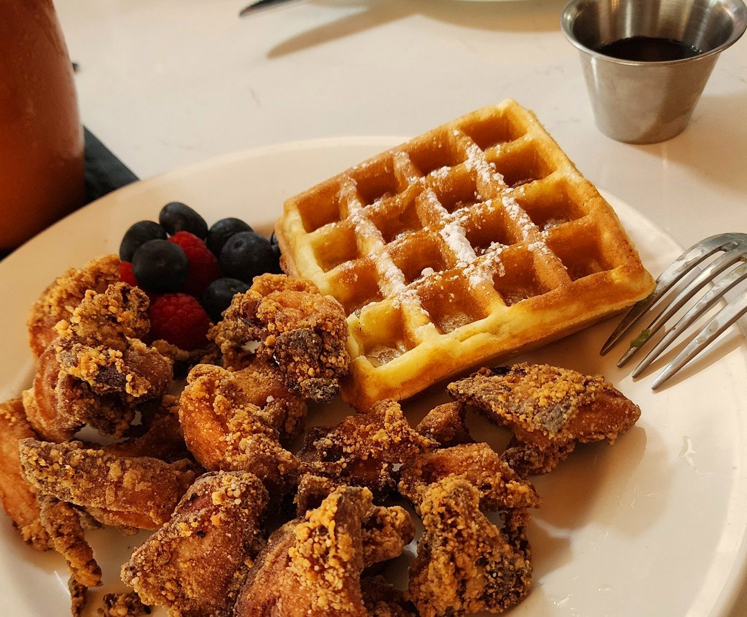 Chicken and waffles at Primo's in Bellevue, with berries and syrup on the side