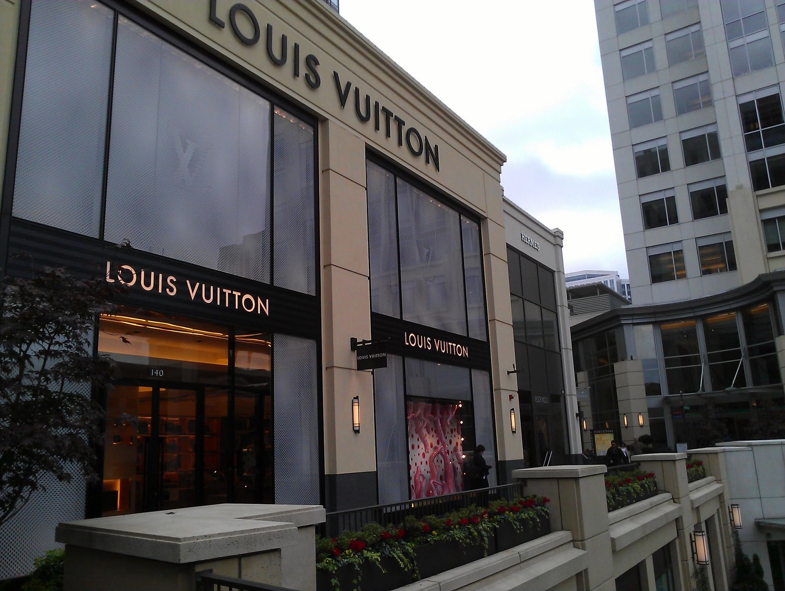 A Louis Vuitton storefront on a city street