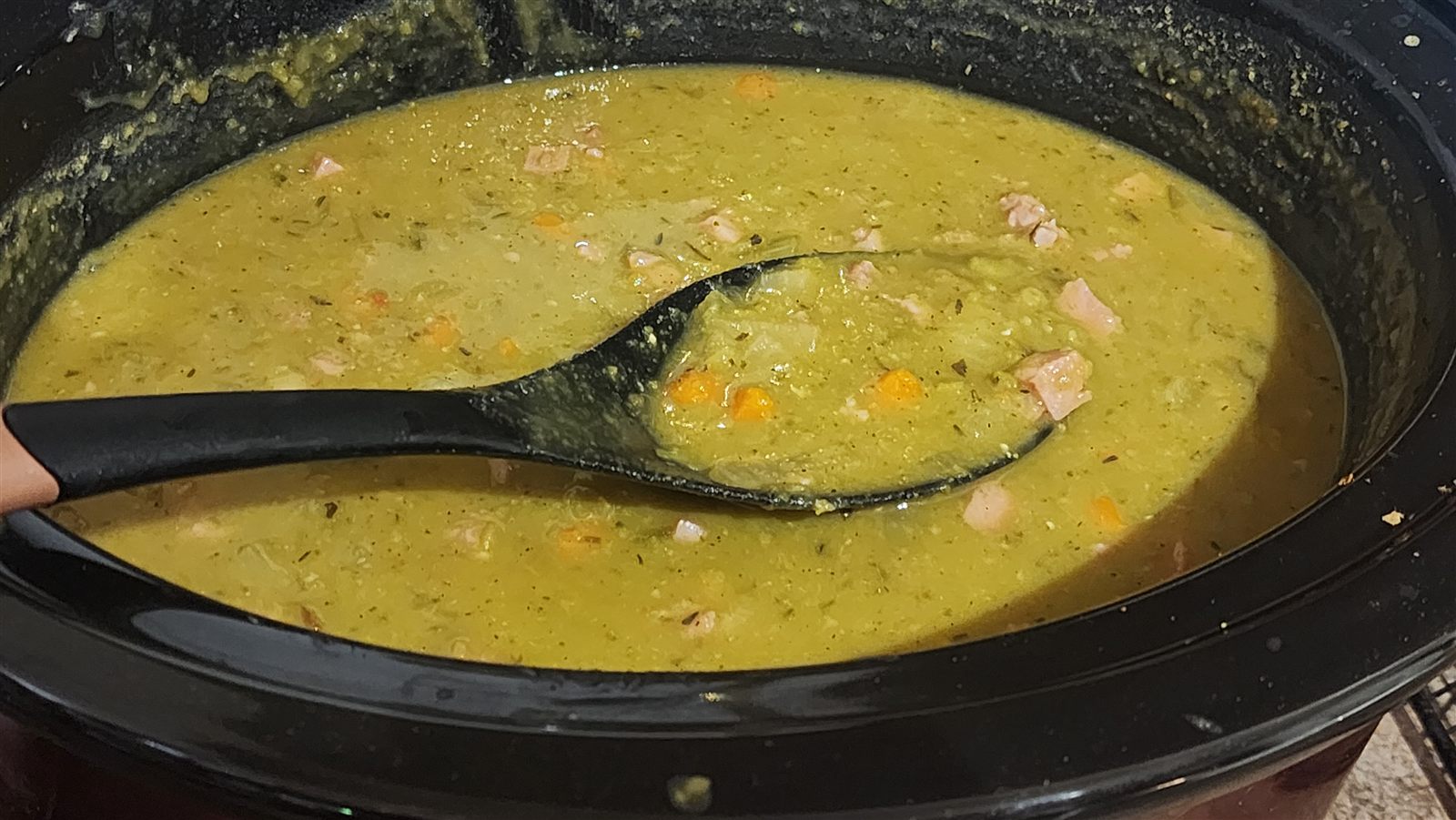 Finished split pea soup with ham and carrots in the slow cooker